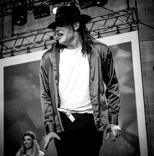 On a festival stage, mid-number