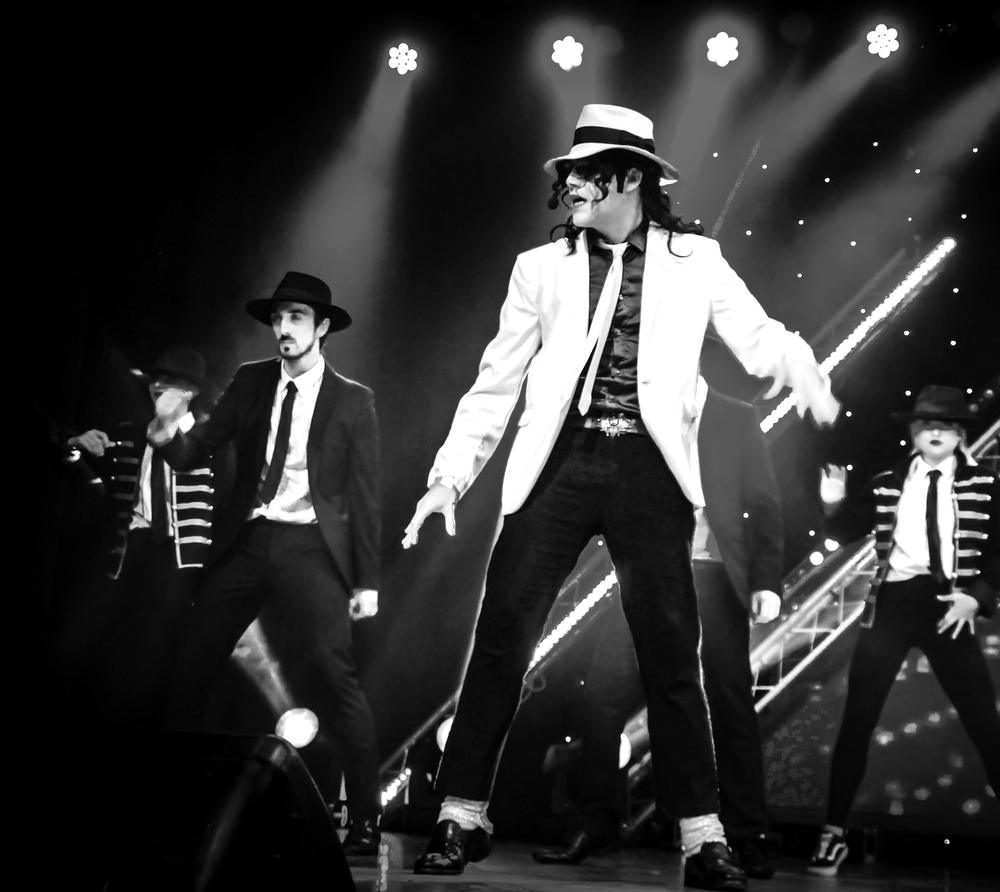 David Boakes performing live with band and dancers